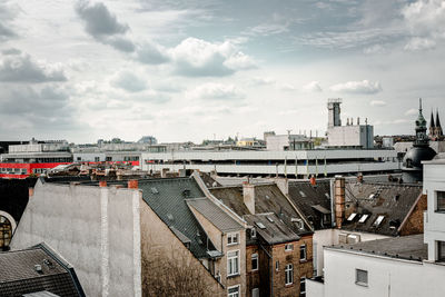 Cityscape against cloudy sky