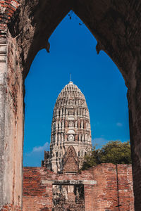 Low angle view of historical building against blue sky