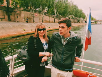 Young couple standing against built structure