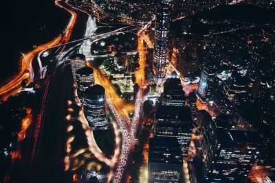 Aerial view of illuminated city at night