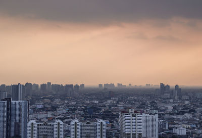 High angle view of buildings against sky during sunset