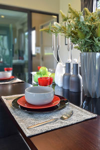 Bowls and plates arranged on table