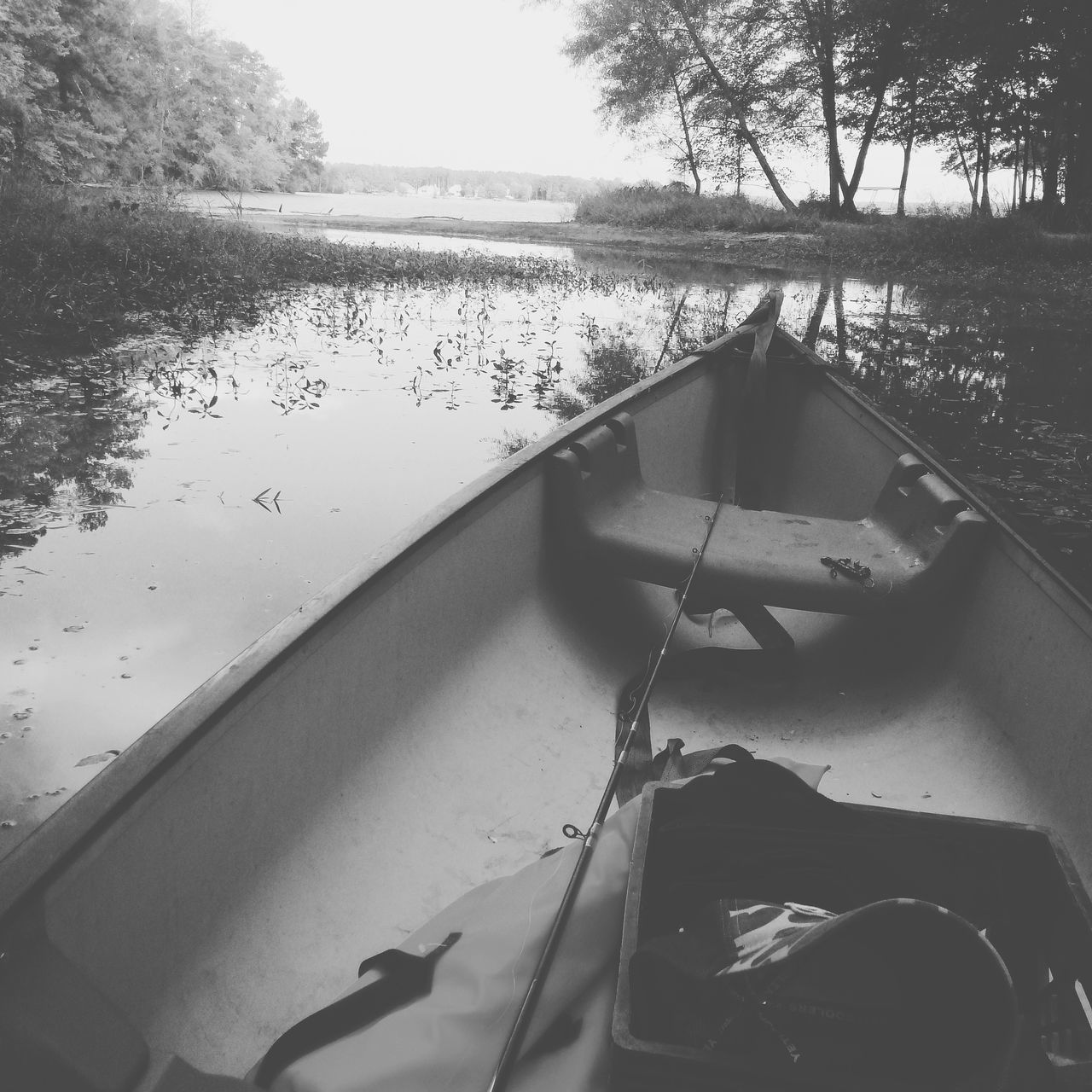 water, nautical vessel, boat, tranquil scene, tranquility, reflection, river, scenics, riverbank, day, sky, nature, non-urban scene, bridge, canal, no people, lakeside