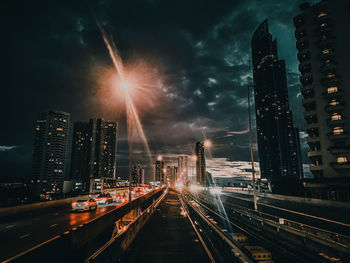 Panoramic view of city street and buildings at night