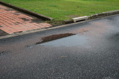 High angle view of puddle on street