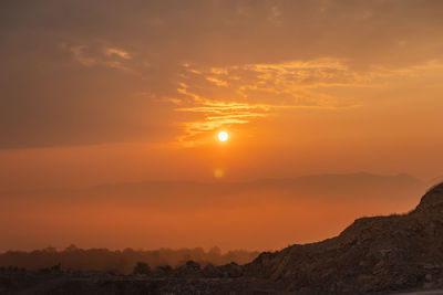 Scenic view of silhouette landscape against sky during sunset