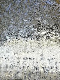 Full frame shot of water flowing through rocks