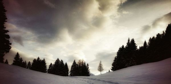 Scenic view of mountains against cloudy sky