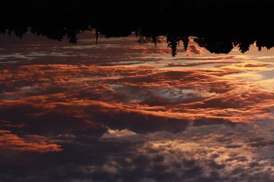 Low angle view of dramatic sky during sunset