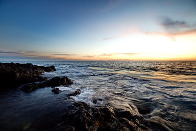 Scenic view of sea against sky during sunset