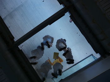 Low angle view of glass window in building