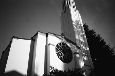 Low angle view of illuminated building against sky