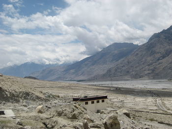 Scenic view of landscape and mountains against sky