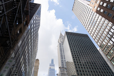 Low angle view of buildings in city against sky