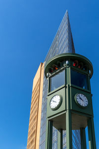 Low angle view of clock tower against sky