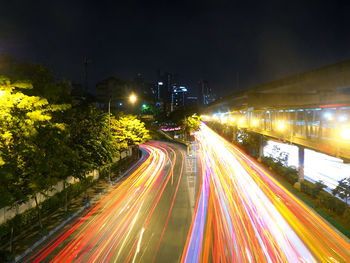 High angle view of light trails on road at night