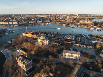 High angle view of river amidst buildings in city