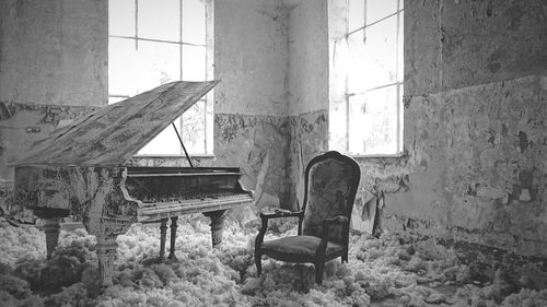 Damaged chair in abandoned room