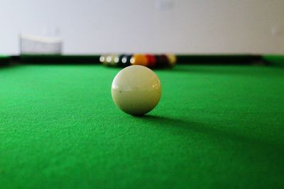 Close-up of pool ball on table