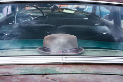 Hat in rear window of vintage car 