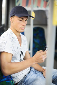 Teenage boy sitting in bus