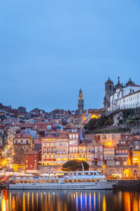 Illuminated buildings in city at night