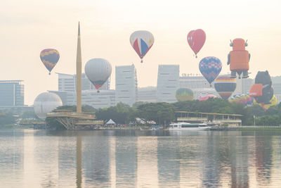 View of hot air balloon flying over river