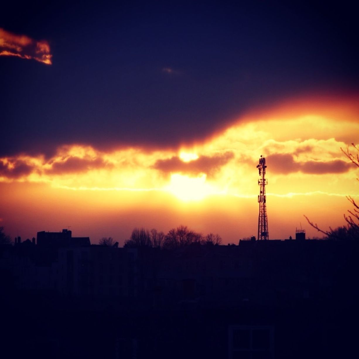 sunset, silhouette, orange color, sky, cloud - sky, built structure, building exterior, architecture, beauty in nature, electricity pylon, nature, scenics, low angle view, dramatic sky, cloud, fuel and power generation, technology, electricity, outdoors, cloudy