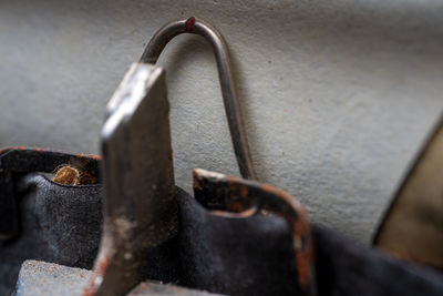 Close-up of padlock on rusty metal