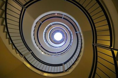 Low angle view of spiral staircase in building