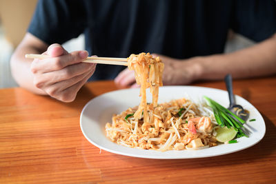 Midsection of man preparing food