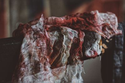 Close-up of blooded bandage on railing