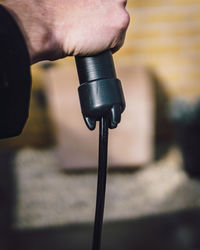 Close-up of man working on metal