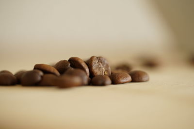 Close-up of coffee beans on table