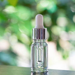 Close-up of glass bottle on table