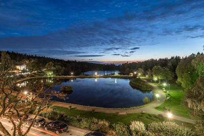 Scenic view of lake against sky at night