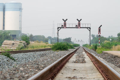 Railroad tracks against clear sky