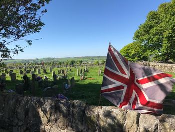 Scenic view of flag against clear blue sky