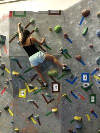 High angle view of woman with multi colored umbrella