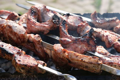 Close-up of meat on barbecue grill