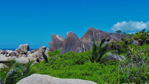 View of a rock against blue sky