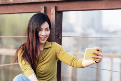 Young woman using mobile phone