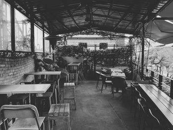 Empty chairs and tables in cafe