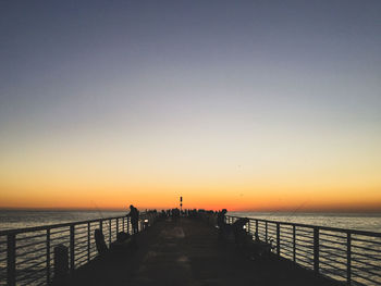 Scenic view of sea against clear sky during sunset