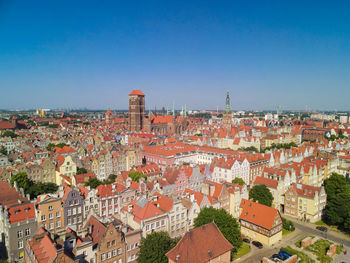 High angle shot of townscape against clear blue sky