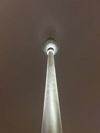 Low angle view of communications tower against sky