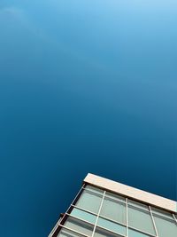 Low angle view of building against blue sky