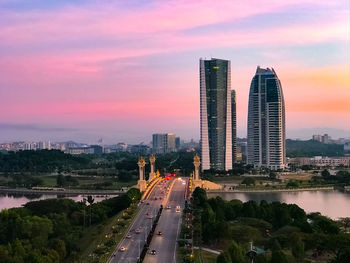 Panoramic view of city and buildings against sky during sunset