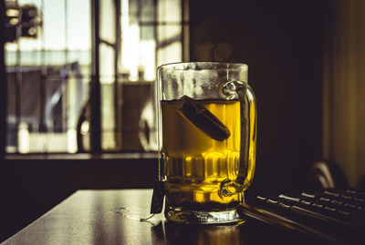 Close-up of beer glass on table