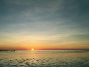 Scenic view of sea at sunset